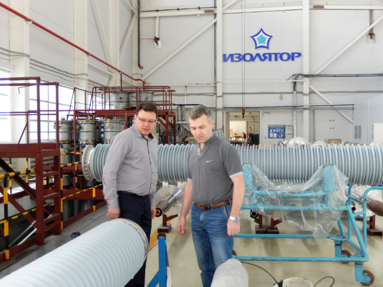 Sergey Taradanov (R) and Oleg Bakulin at the assembly shop of Izolyator plant