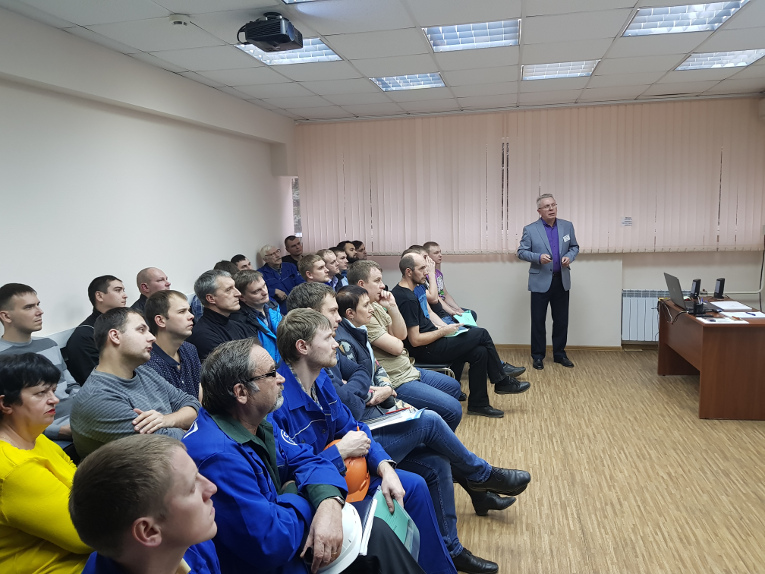 Victor Kiryukhin is speaking in front of Togliatti Transformer technical specialists