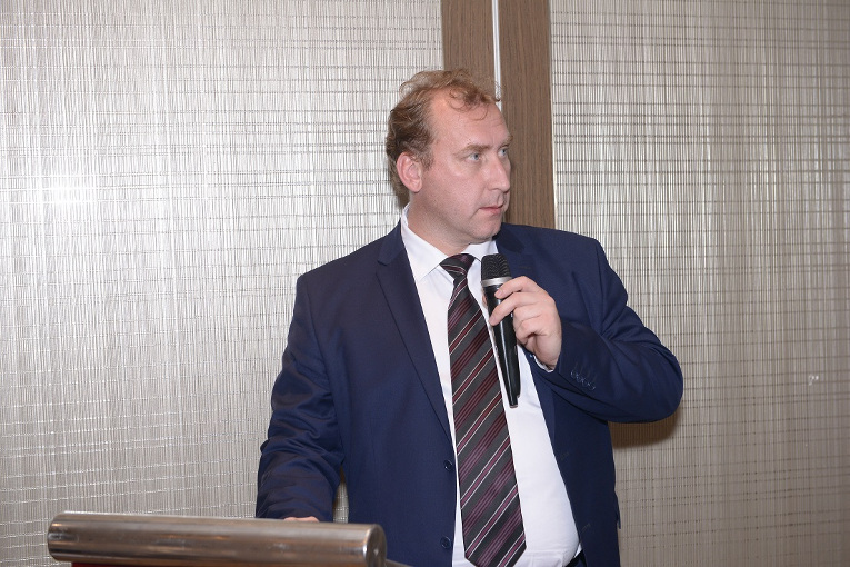 D. Egorov, Deputy Director of Export Department at Uncomtech trading is making a report