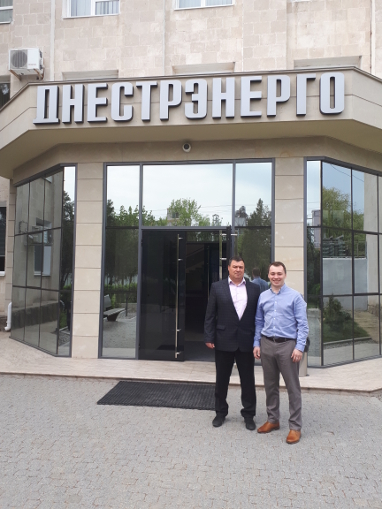 General Director of Valkiria Ltd Ivan Lupashko (L) and Dmitry Karasev in front of the head office of SUE GC Dnestrenergo