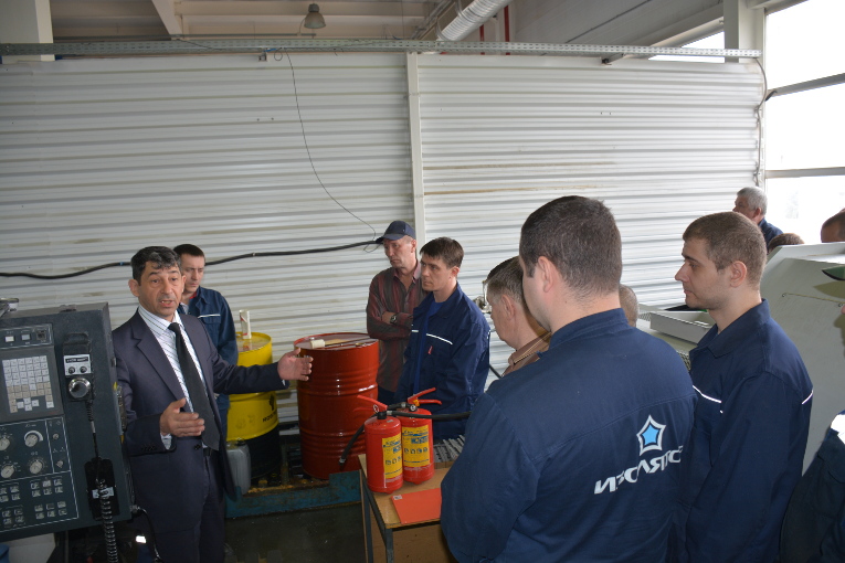 Boris Sobelman is giving a task on fire safety to the workers of the mechanical shop of Izolyator plant