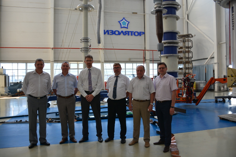 RusHydro Group representatives at the test center of Izolyator plant, L-R: Konstantin Sipilkin, Alexander Slavinsky, Deputy Chief Engineer at RusHydro Group Dmitry Kolesnikov, Head of Electrical Equipment Directorate at RusHydro Group Alexander Okhrim, Vladimir Ustinov and Oleg Bakulin