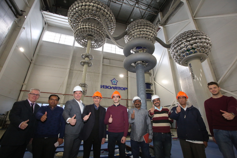 Group photo with specialists, inspecting testing of high-voltage bushings, which were developed and manufactured under the order of the Indian state power grid company Power Grid Corporation of India Limited