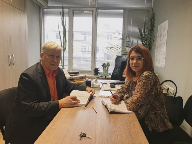 Head of the insulation and surge protection department of Moldelectrica Vladimir Sitnikov and Anna Zubakova during a business meeting in the Moldelectrica in Moldova