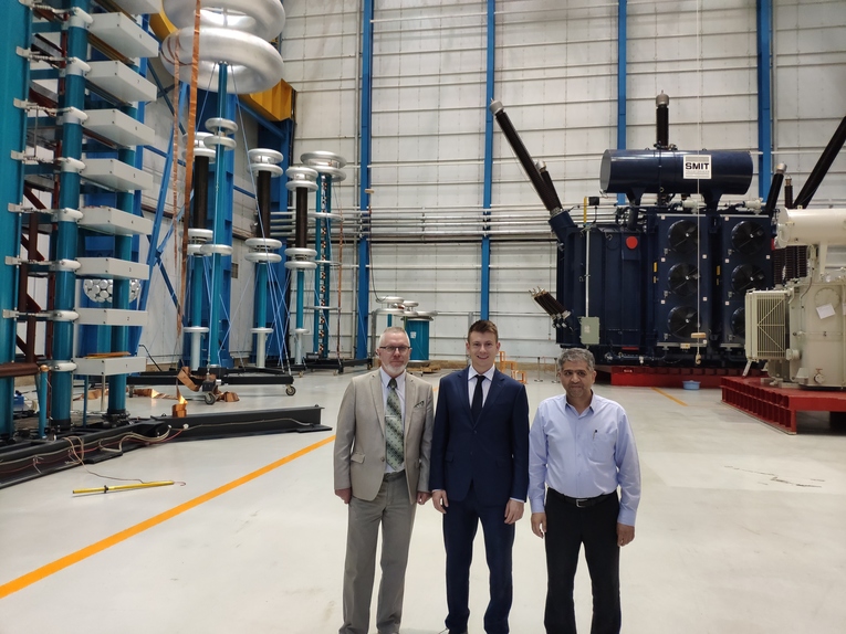 Izolyator representatives at the test center of the Iranian transformer plant Arya Transfo Group