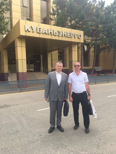 Alexander Slavinsky (L) and Grigory Masin by the head office of Kubanenergo
