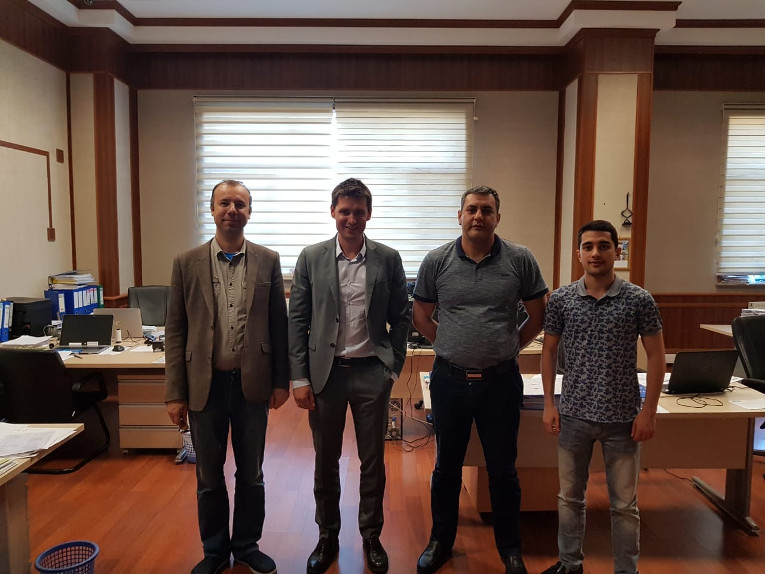 Participants of one of the meetings at the power transformer plant of ATEF Group, L-R: Chief Process Engineer Pavel Butyaev, Maxim Zagrebin, Sales Director Farid Aliev, Secretary of the Chairman Firuddin Aliev.