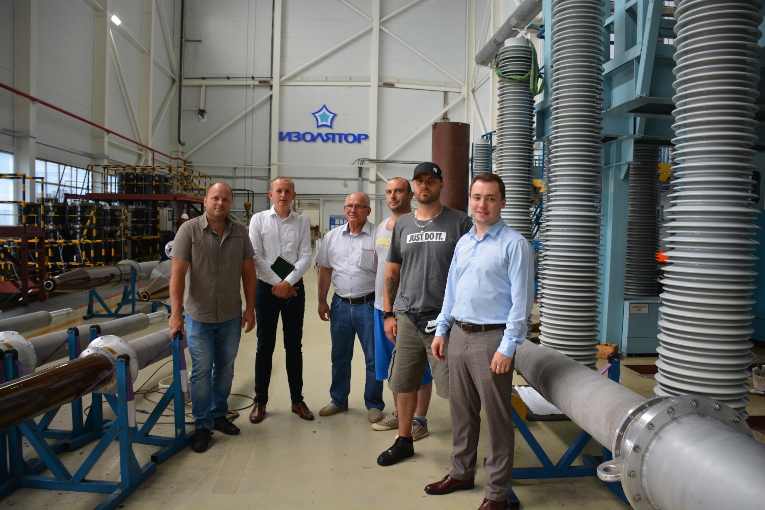 Participants of inspection of bushings’ readiness for 750 kV Belarusian substation at the assembly shop of Izolyator plant, L-R: Dmitry Mashinistov, Production Manager at Montazhelectrotrade ChPTUP Sergey Kmito, Supervision Superintendent at Electrocentrmontazh Plc Anatoly Avgustinovich, Electrical Fitting Foreman at Montazhelectrotrade ChPTUP Maxim Zuev, staff member of the representative office of Riko in Belarus Maxim Knutovich and Dmitry Karasev