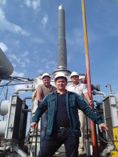 The first in Belarus 750 kV RIP bushing by Izolyator has been installed, L-R: Dmitry Mashinistov, Lead Engineer at Riko representative office in Belarus Anatoly Tereschuk and Chief of 750 kV S/S Belorusskaya Vyacheslav Maskalik