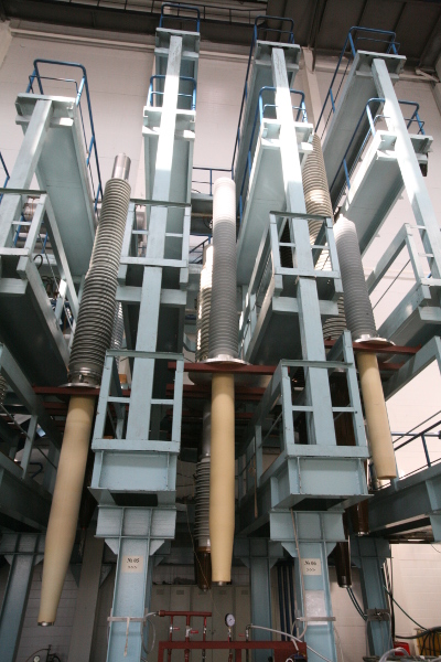 500, 330 and 220 kV RIN bushings placed on technological racks at the assembly shop of Izolyator plant