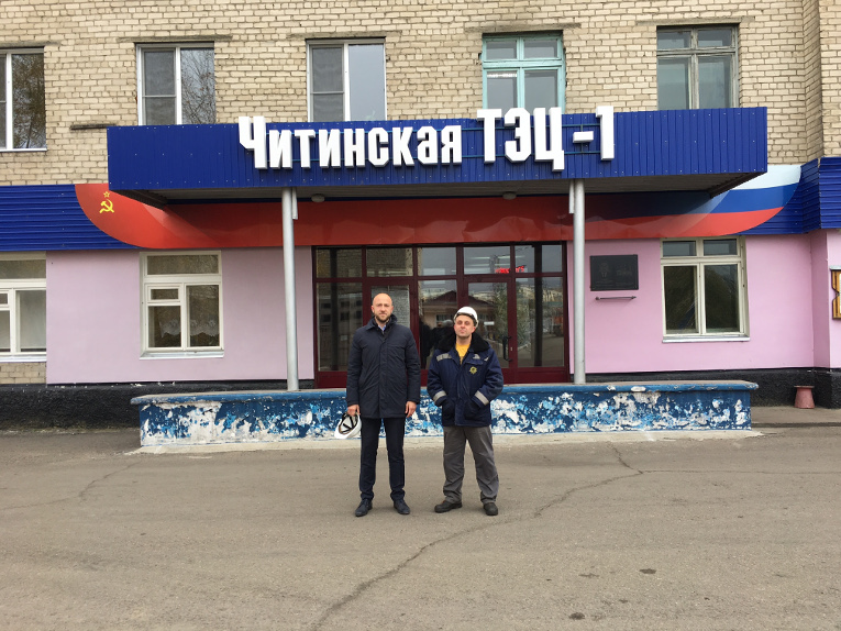 Alexander Savinov (L) and Denis Savchenko by the head office of Chita TPP-1, branch of TGC-14