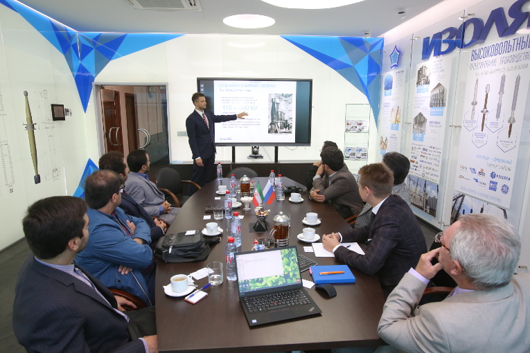 Dmitriy Orekhov is giving a presentation about Izolyator for MREC and Iran Transfo Co. representatives