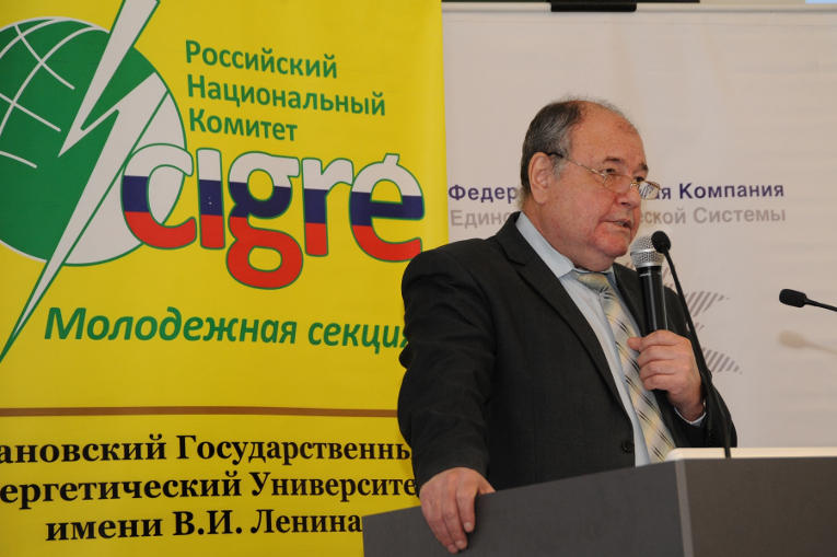 Vladimir Ustinov is making a report to the students — participants of the Olympics — about the activities of D1 RNC CIGRE